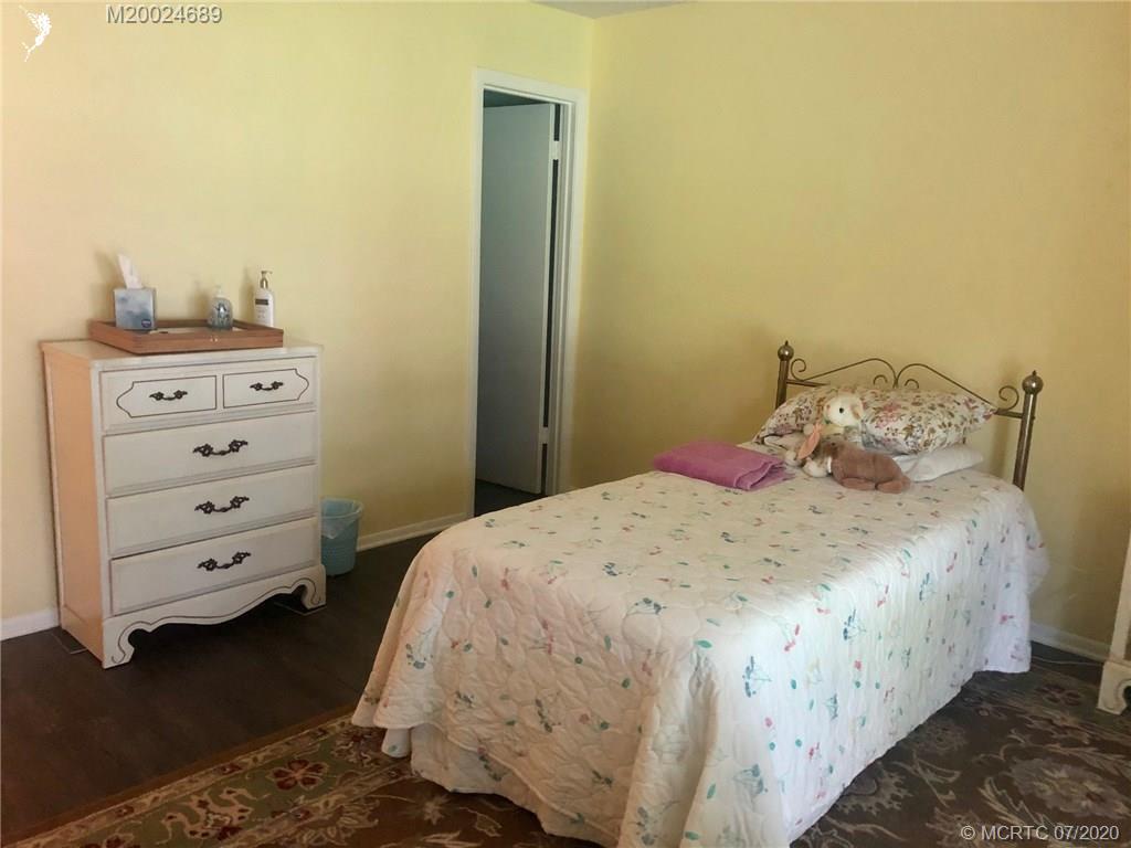 1225 Northwest 21st Street, Unit 2908 Stuart, FL 34994 - Photo 22 of 56 a bedroom with a bed and closet