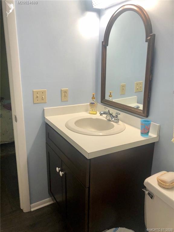 1225 Northwest 21st Street, Unit 2908 Stuart, FL 34994 - Photo 24 of 56 a bathroom with a sink and a toilet