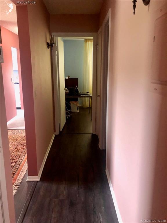 1225 Northwest 21st Street, Unit 2908 Stuart, FL 34994 - Photo 27 of 56 a view of a hallway and a livingroom with furniture