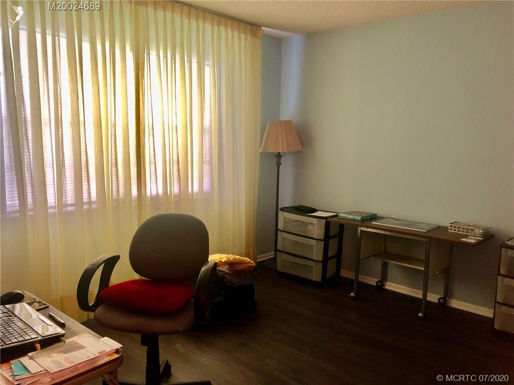 1225 Northwest 21st Street, Unit 2908 Stuart, FL 34994 - Photo 31 of 56 a living room with furniture and a window
