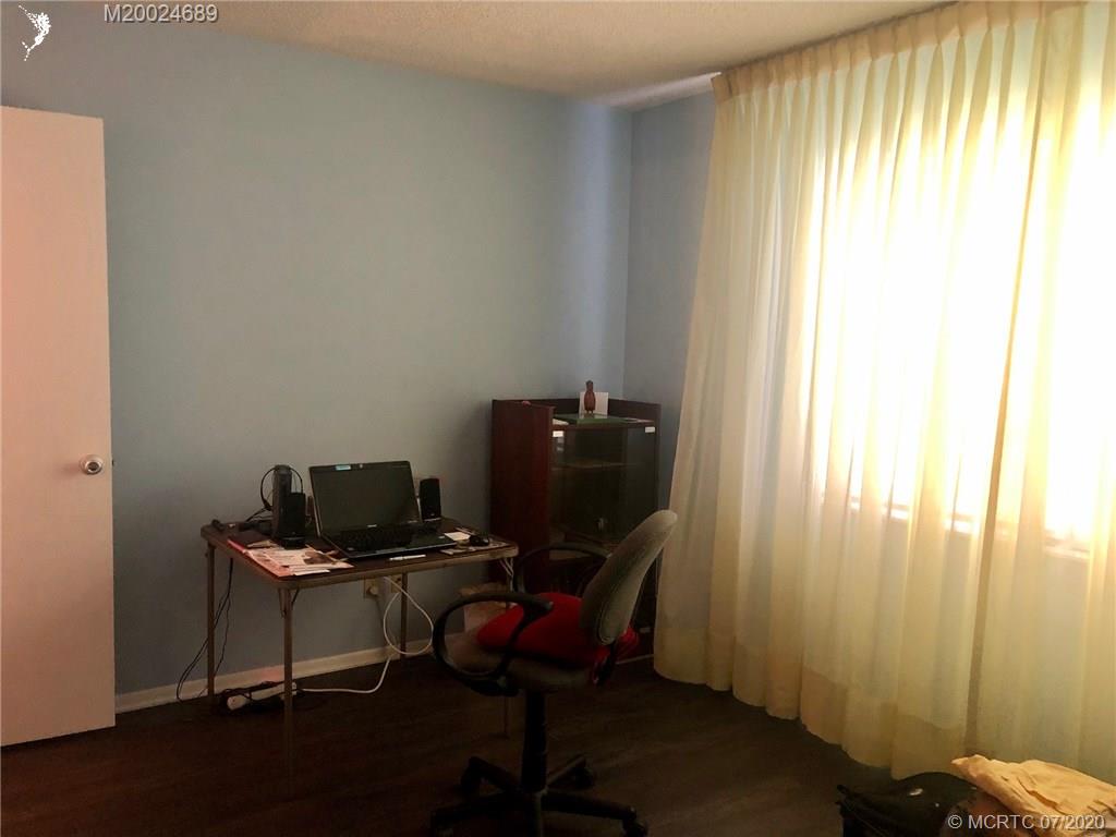 1225 Northwest 21st Street, Unit 2908 Stuart, FL 34994 - Photo 32 of 56 a view of a workspace with furniture and a window