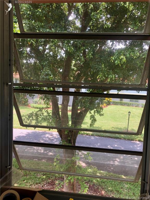 1225 Northwest 21st Street, Unit 2908 Stuart, FL 34994 - Photo 34 of 56 a view of swimming pool from a window