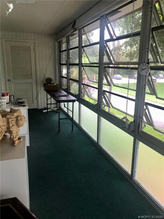 1225 Northwest 21st Street, Unit 2908 Stuart, FL 34994 - Photo 35 of 56 a living room with furniture and a window