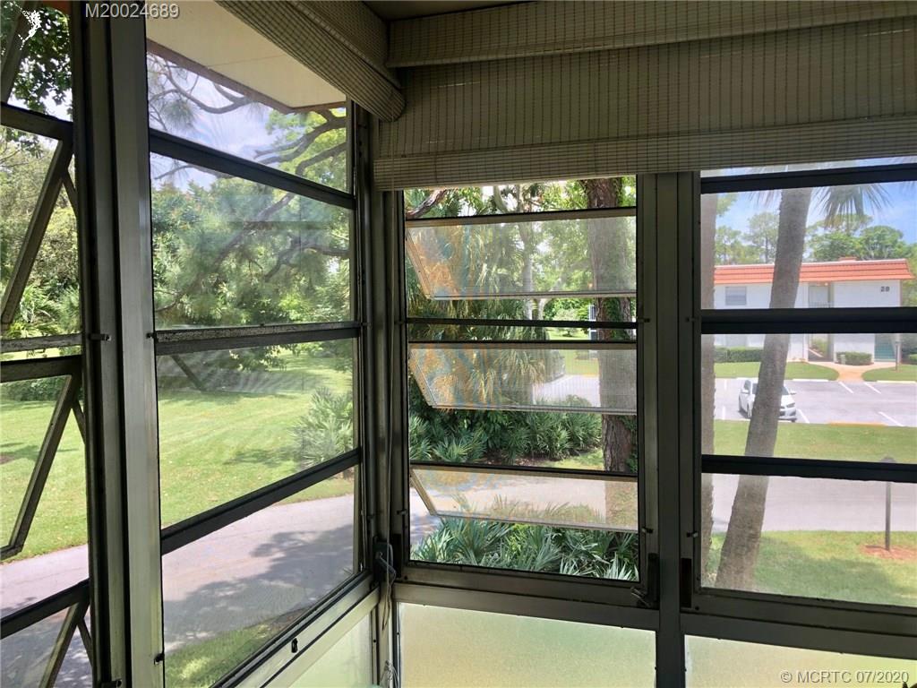 1225 Northwest 21st Street, Unit 2908 Stuart, FL 34994 - Photo 39 of 56 a view of outdoor with a large window