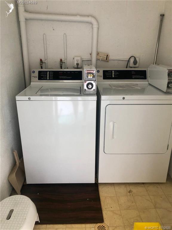 1225 Northwest 21st Street, Unit 2908 Stuart, FL 34994 - Photo 41 of 56 a utility room with dryer and washer