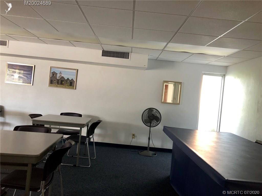 1225 Northwest 21st Street, Unit 2908 Stuart, FL 34994 - Photo 46 of 56 a view of a workspace with furniture