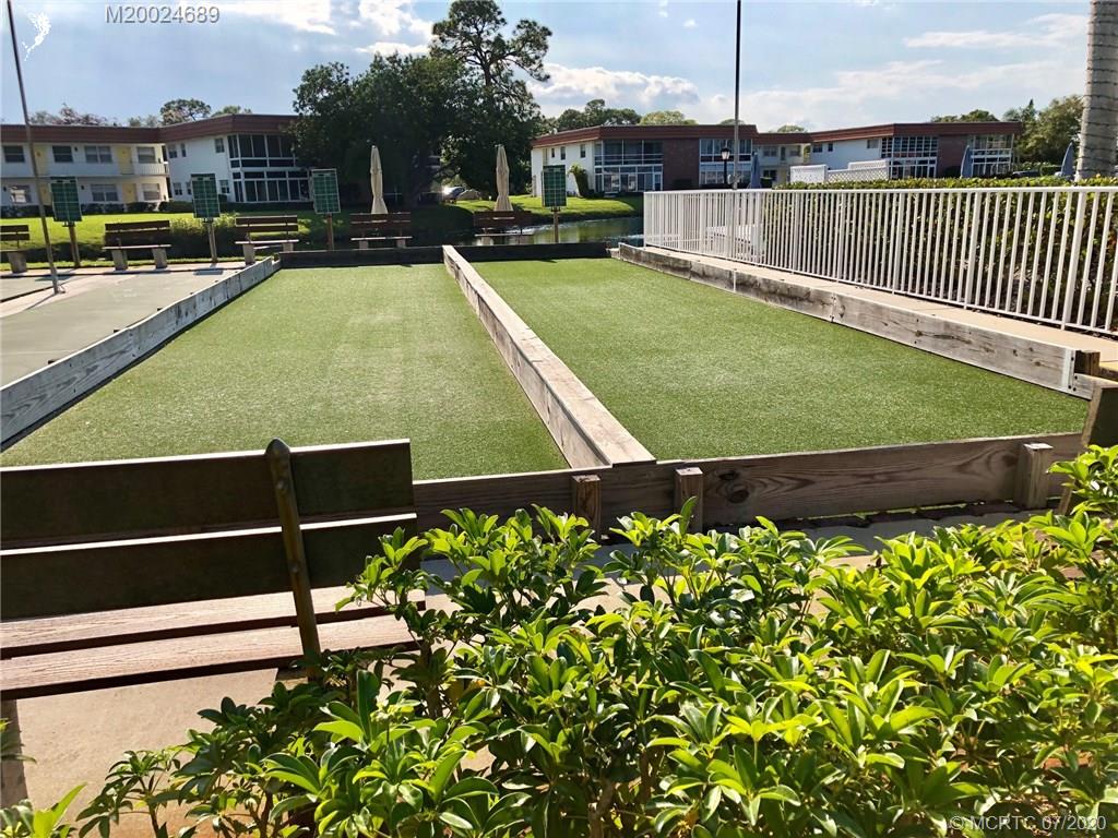 1225 Northwest 21st Street, Unit 2908 Stuart, FL 34994 - Photo 52 of 56 a view of a yard with a park