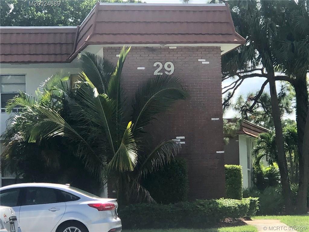1225 Northwest 21st Street, Unit 2908 Stuart, FL 34994 - Photo 56 of 56 a front view of a house with plants