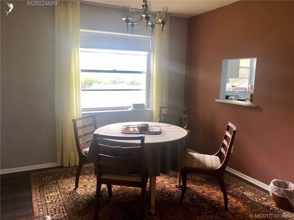 1225 Northwest 21st Street, Unit 2908 Stuart, FL 34994 - Photo 8 of 56 a view of a dining room with furniture and window