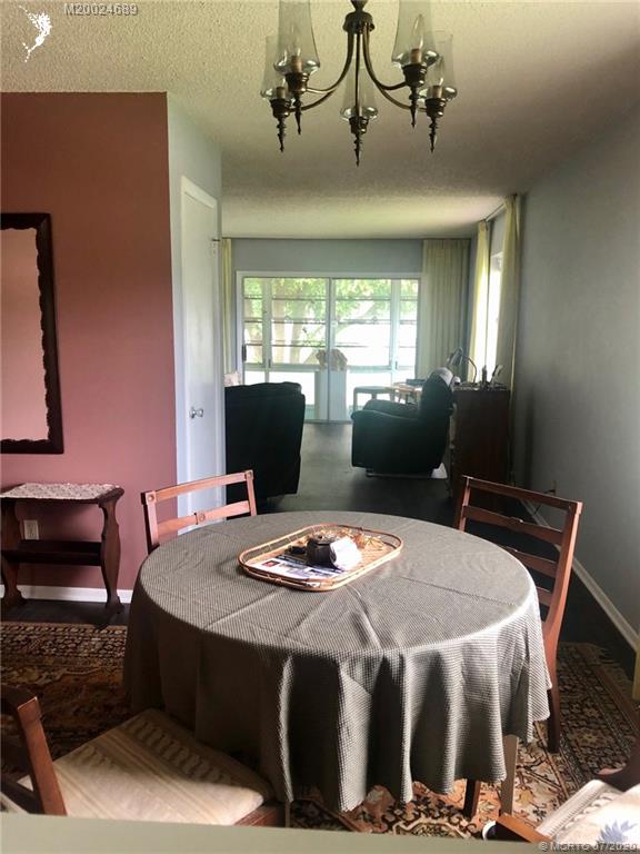 1225 Northwest 21st Street, Unit 2908 Stuart, FL 34994 - Photo 9 of 56 a bedroom with a bed and wooden floor