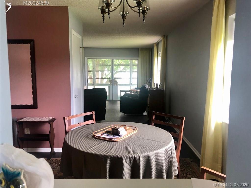 1225 Northwest 21st Street, Unit 2908 Stuart, FL 34994 - Photo 10 of 56 a dining room with furniture and window