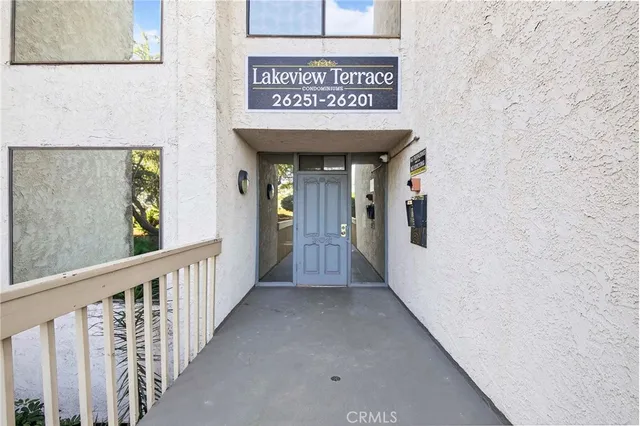 a view of a hallway with wooden wall