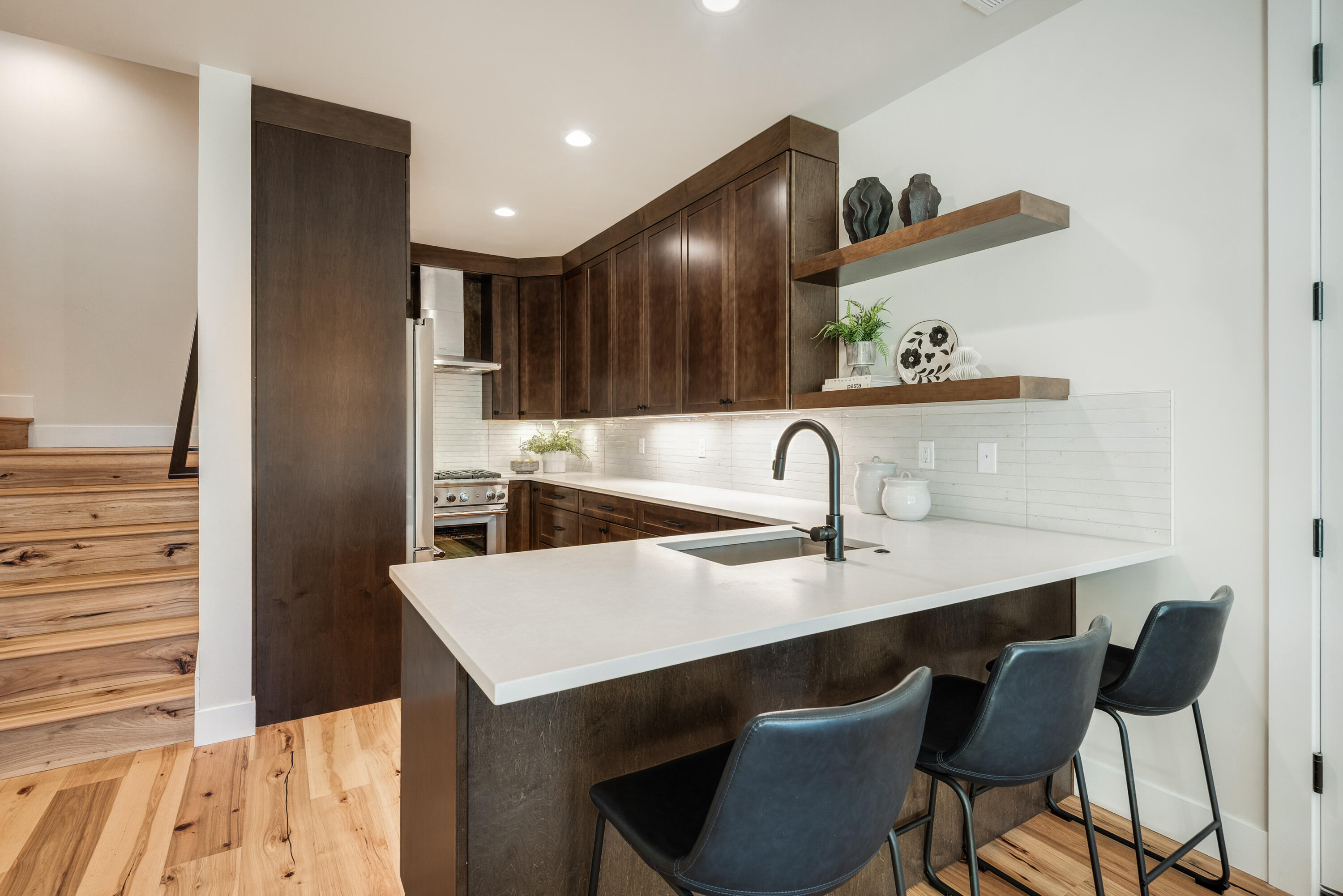 334 Southwest Roosevelt Avenue, Unit 4 Bend, OR 97702 - Photo 8 of 22 a kitchen with a sink cabinets and appliances