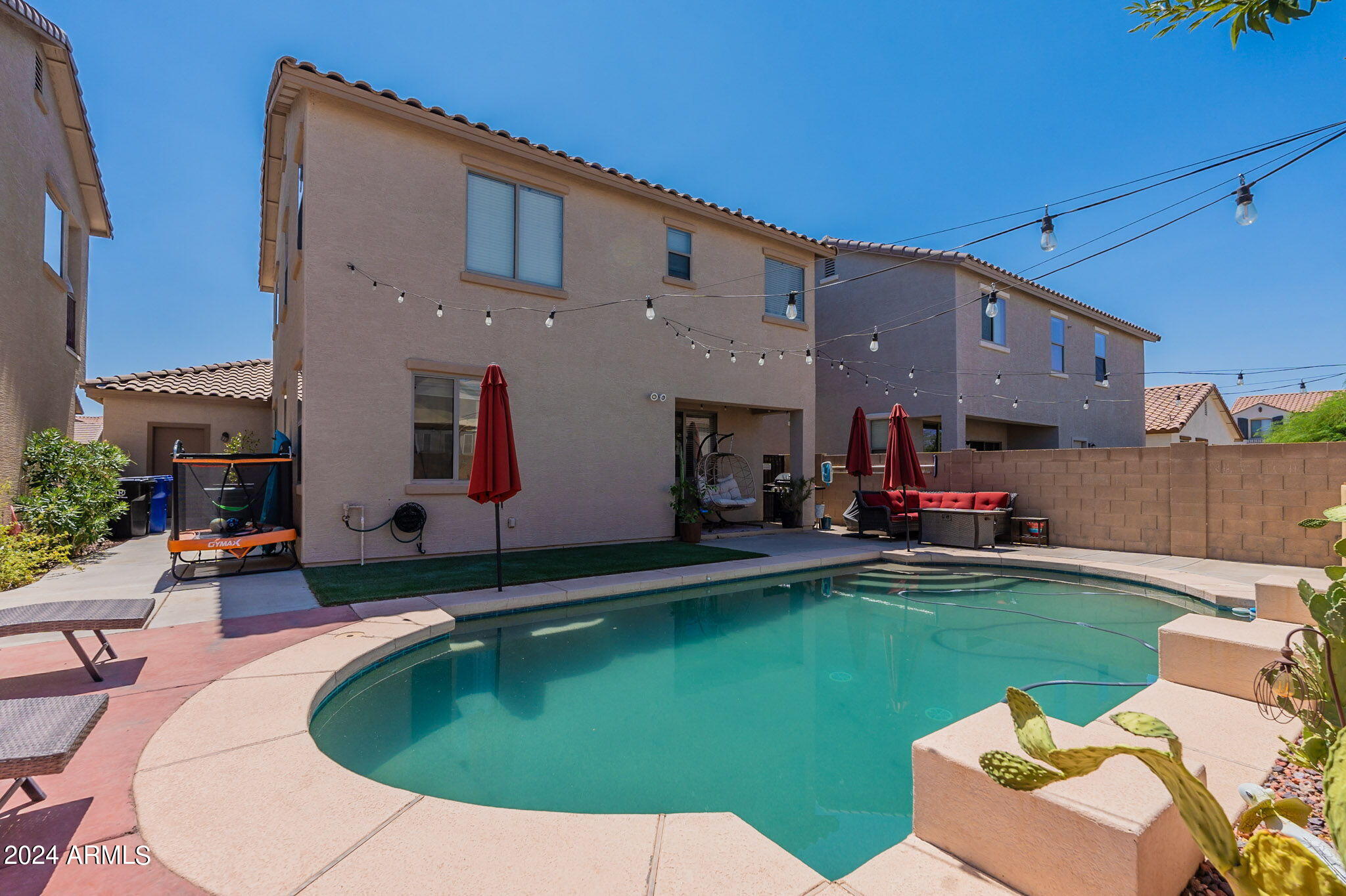 14760 West Riviera Drive Surprise, AZ 85379 - Photo 1 of 30 a view of a house with swimming pool and sitting area