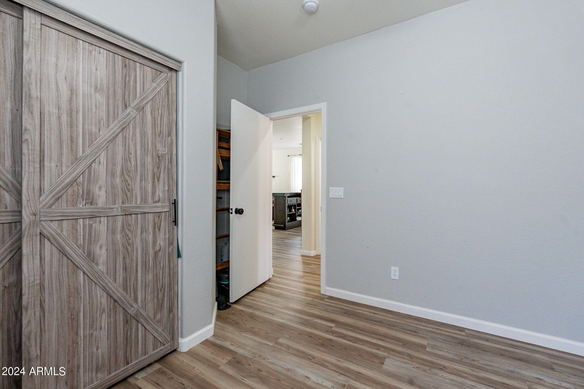 14760 West Riviera Drive Surprise, AZ 85379 - Photo 14 of 30 a view of a hallway with wooden floor and staircase