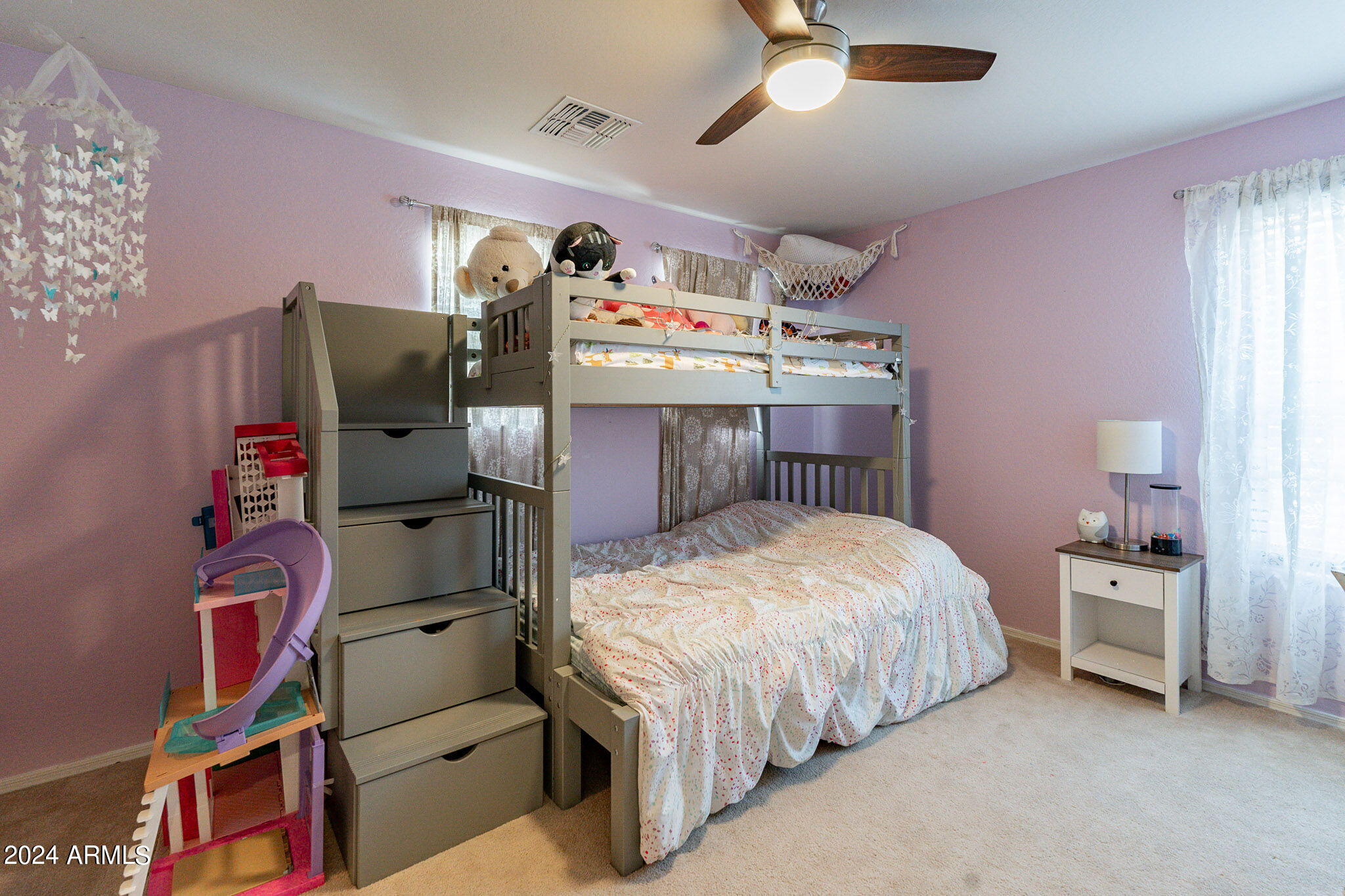 14760 West Riviera Drive Surprise, AZ 85379 - Photo 19 of 30 a bed room with a bed and a chair