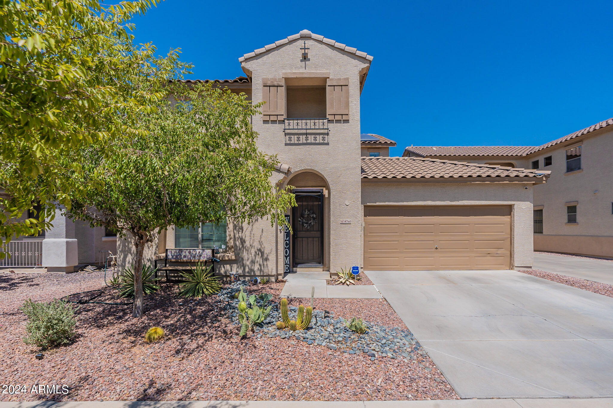 14760 West Riviera Drive Surprise, AZ 85379 - Photo 2 of 30 a front view of a house with a yard