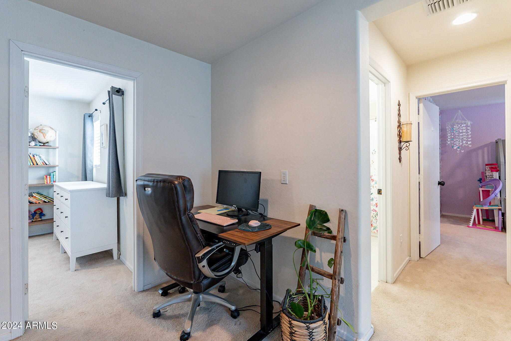 14760 West Riviera Drive Surprise, AZ 85379 - Photo 23 of 30 a view of a workspace with furniture and a window