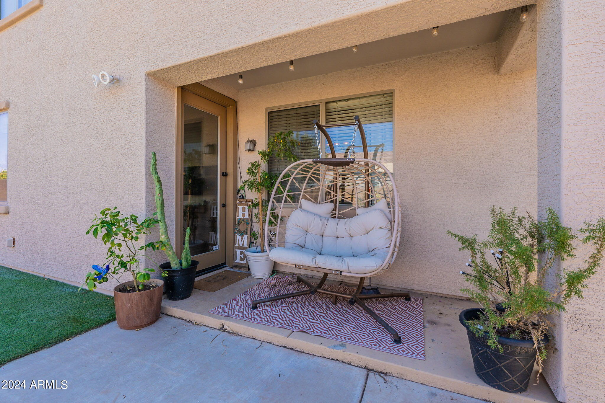 14760 West Riviera Drive Surprise, AZ 85379 - Photo 27 of 30 a front view of a house with outdoor seating