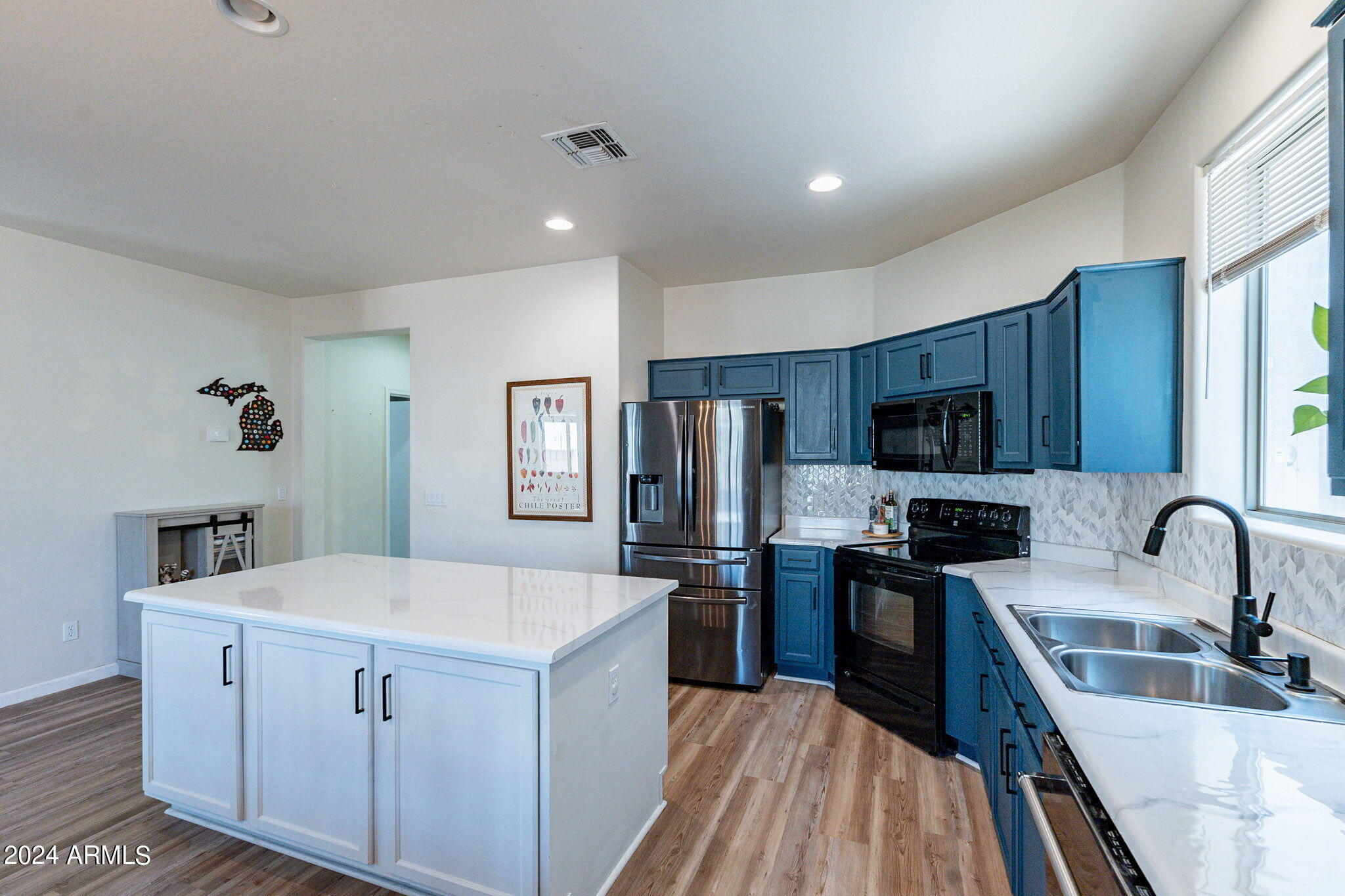 14760 West Riviera Drive Surprise, AZ 85379 - Photo 9 of 30 a kitchen with a sink stove and refrigerator