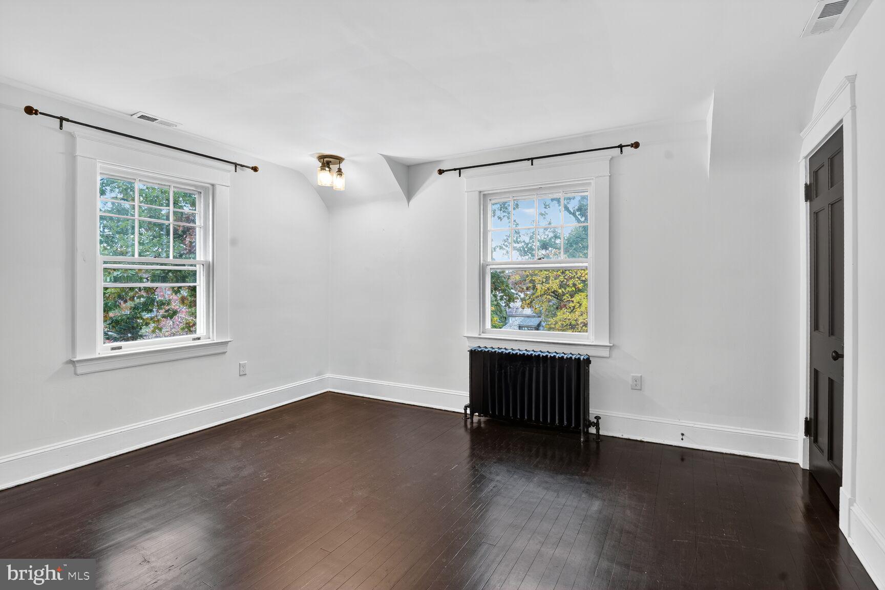 719 Brinkwood Road Baltimore, MD 21229 - Photo 16 of 31 a view of an empty room with wooden floor and a window