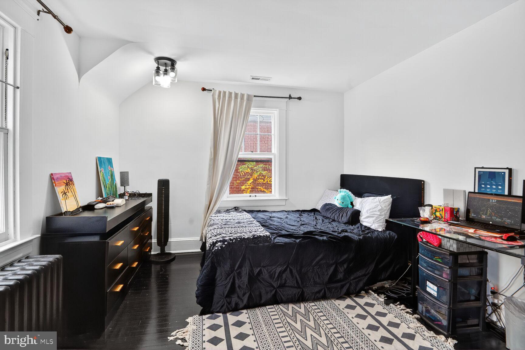 719 Brinkwood Road Baltimore, MD 21229 - Photo 21 of 31 a bedroom with a bed and a window