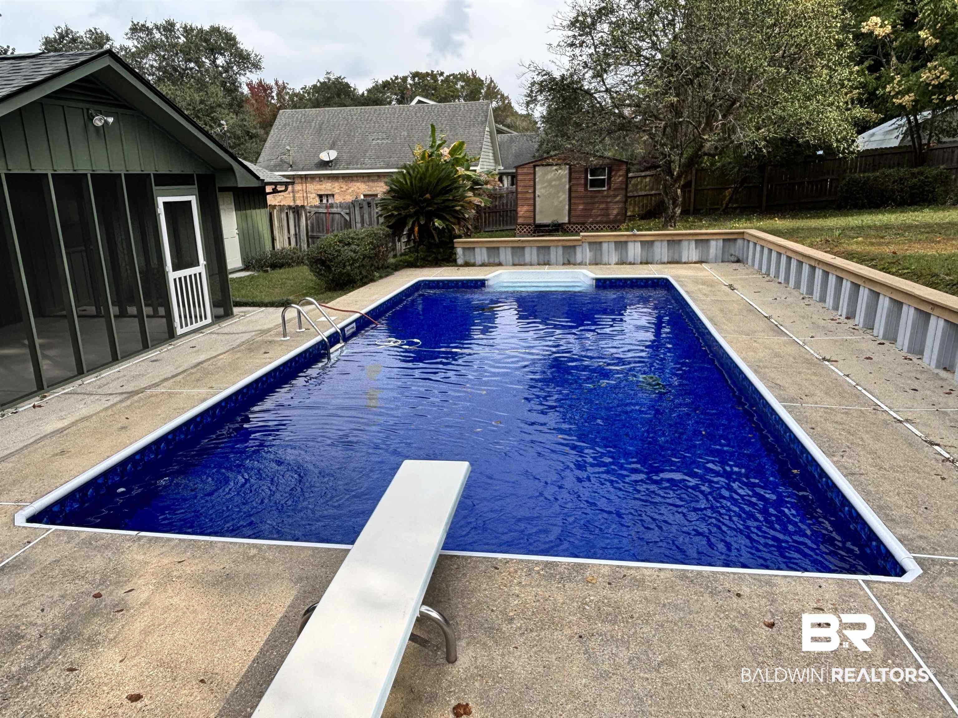 10 Soldiers Route Daphne, AL 36527 - Photo 4 of 26 View of swimming pool with a fenced backyard, a diving board, a storage unit, and a patio area