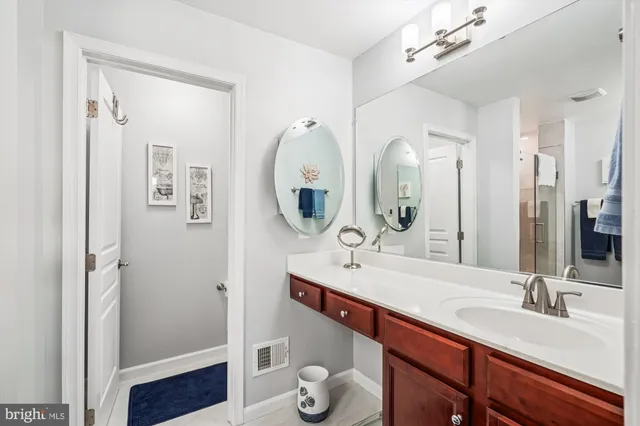 a bedroom with bed and a chandelier