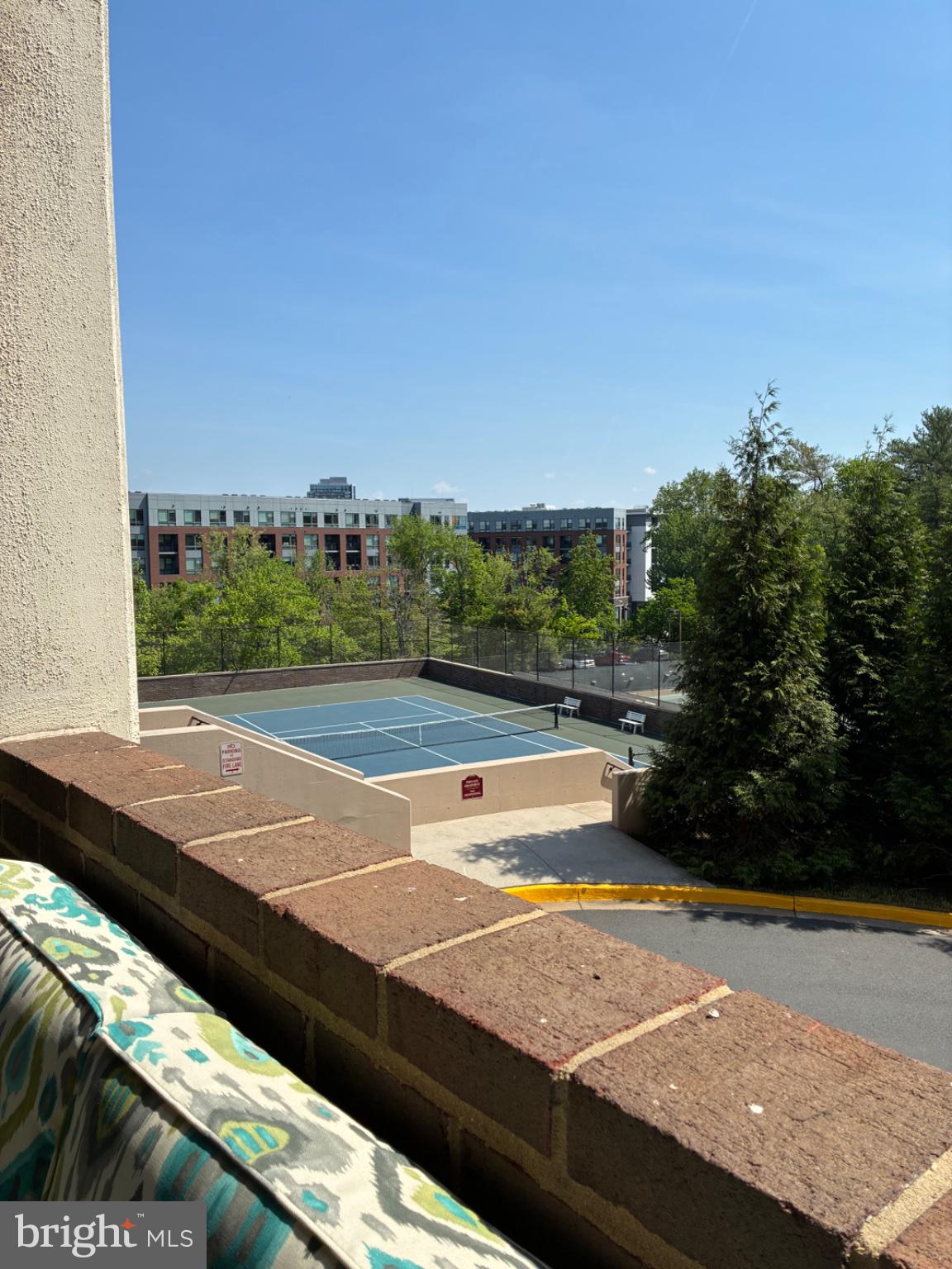 1800 Old Meadow Road, Unit 101 McLean, VA 22102 - Photo 18 of 77 Sunny balcony view with tennis court.