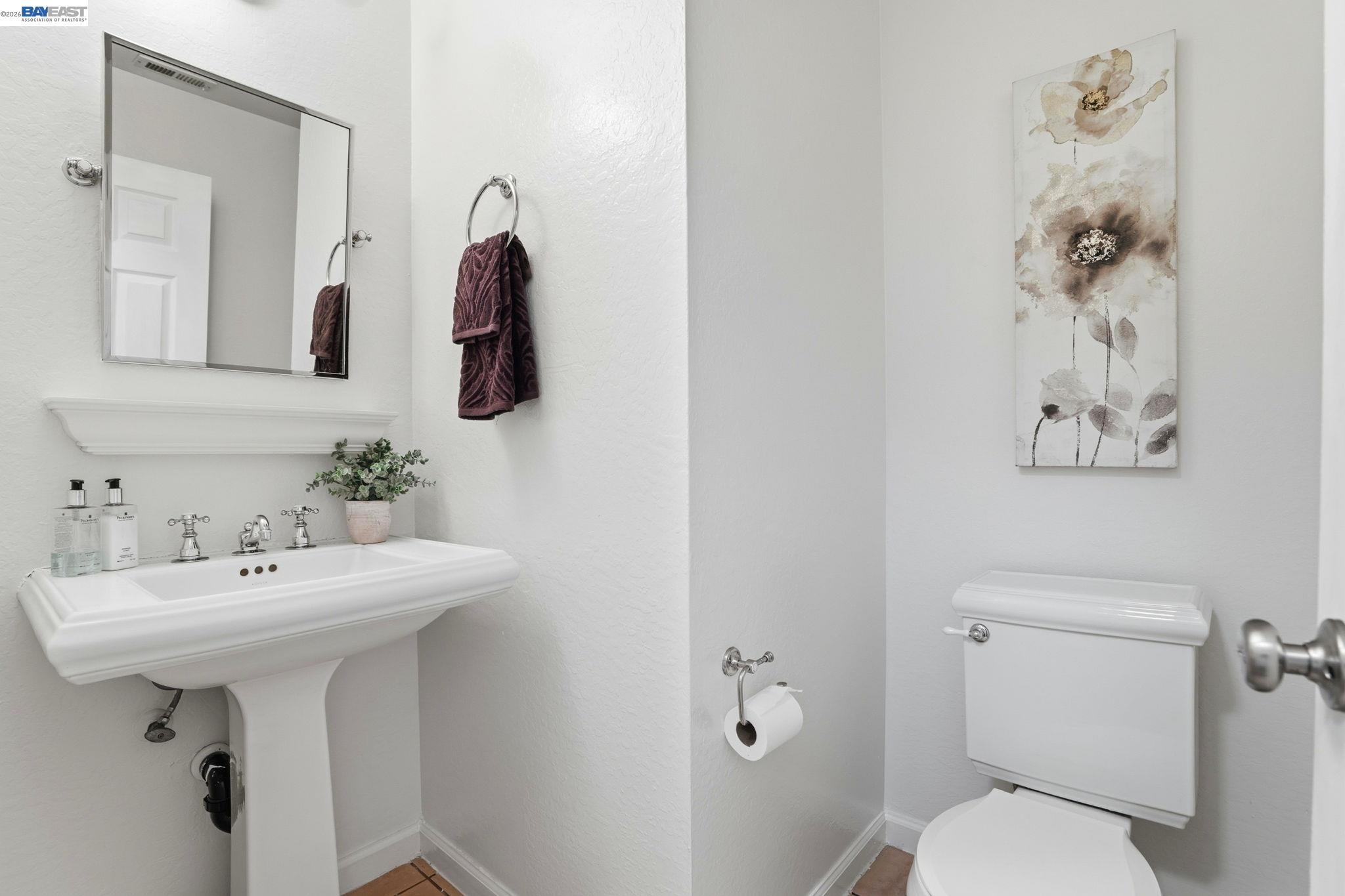 38524 Burdette Common Fremont, CA 94536 - Photo 27 of 35 a bathroom with a sink toilet and mirror