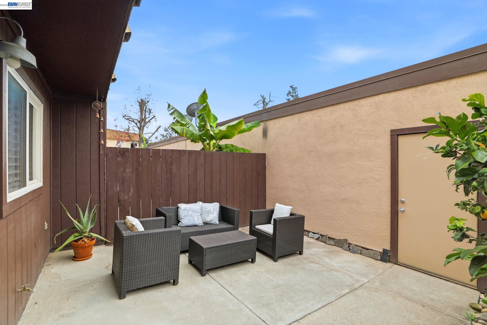 38524 Burdette Common Fremont, CA 94536 - Photo 30 of 35 a backyard of a house with table and chairs