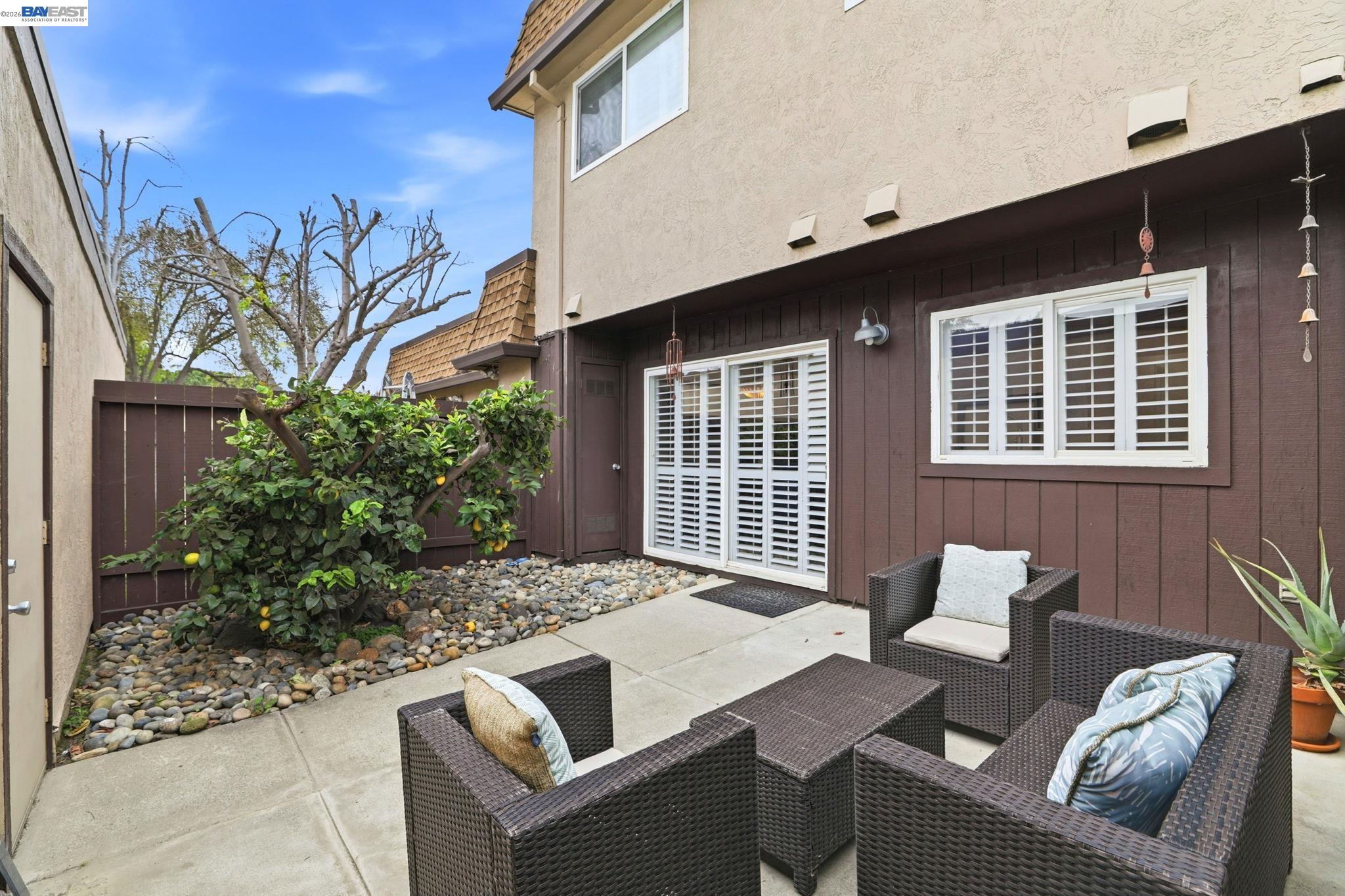 38524 Burdette Common Fremont, CA 94536 - Photo 31 of 35 a backyard of a house with table and chairs
