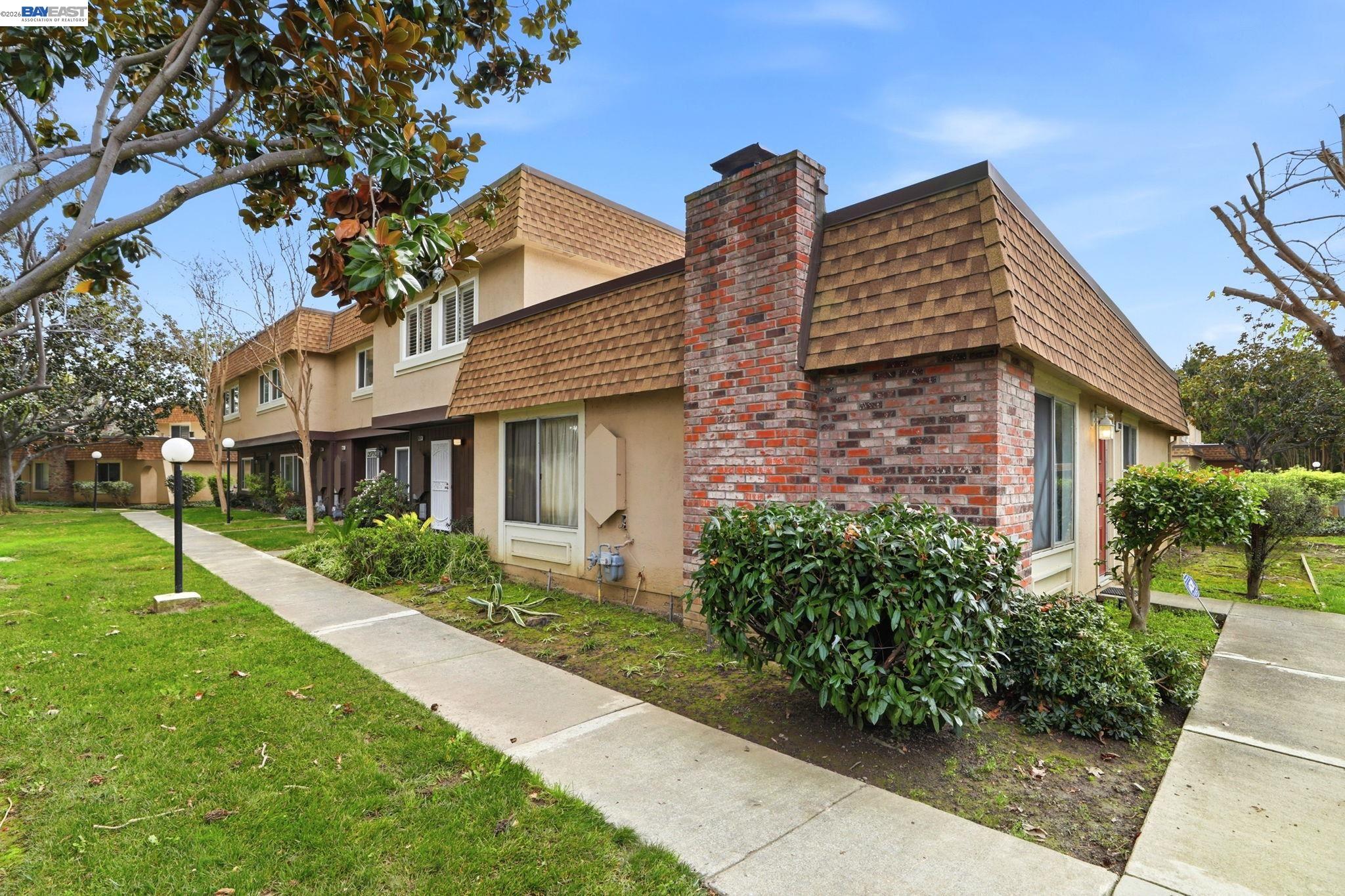38524 Burdette Common Fremont, CA 94536 - Photo 4 of 35 a view of a house with a yard