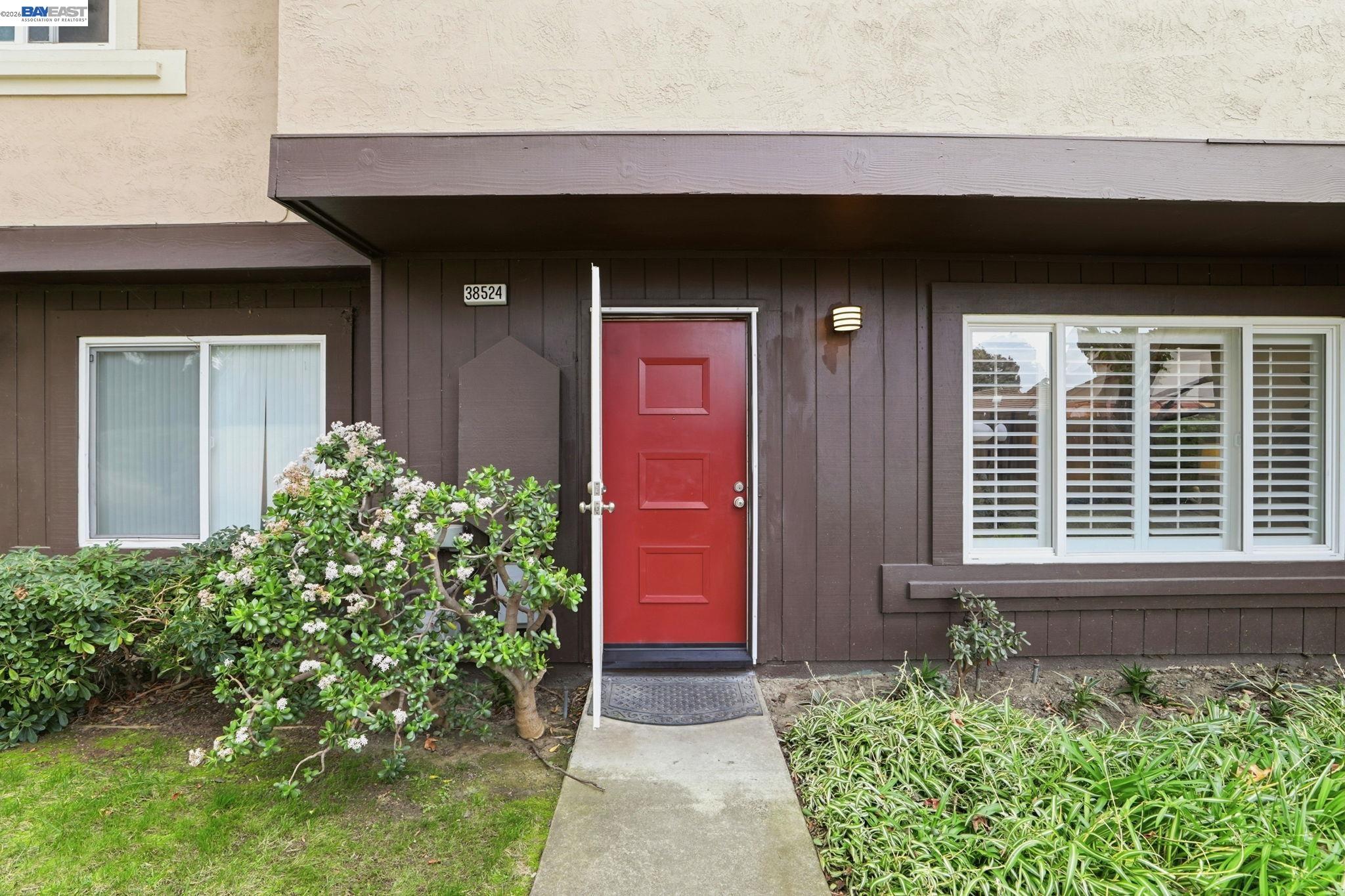 38524 Burdette Common Fremont, CA 94536 - Photo 6 of 35 a front view of a house with a yard