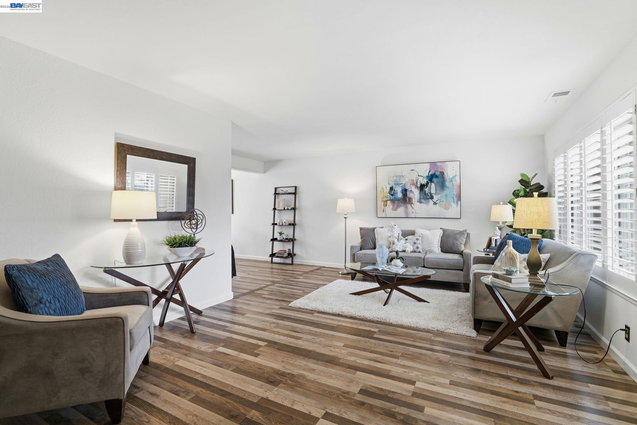 38524 Burdette Common Fremont, CA 94536 - Photo 8 of 35 a living room with furniture and a wooden floor