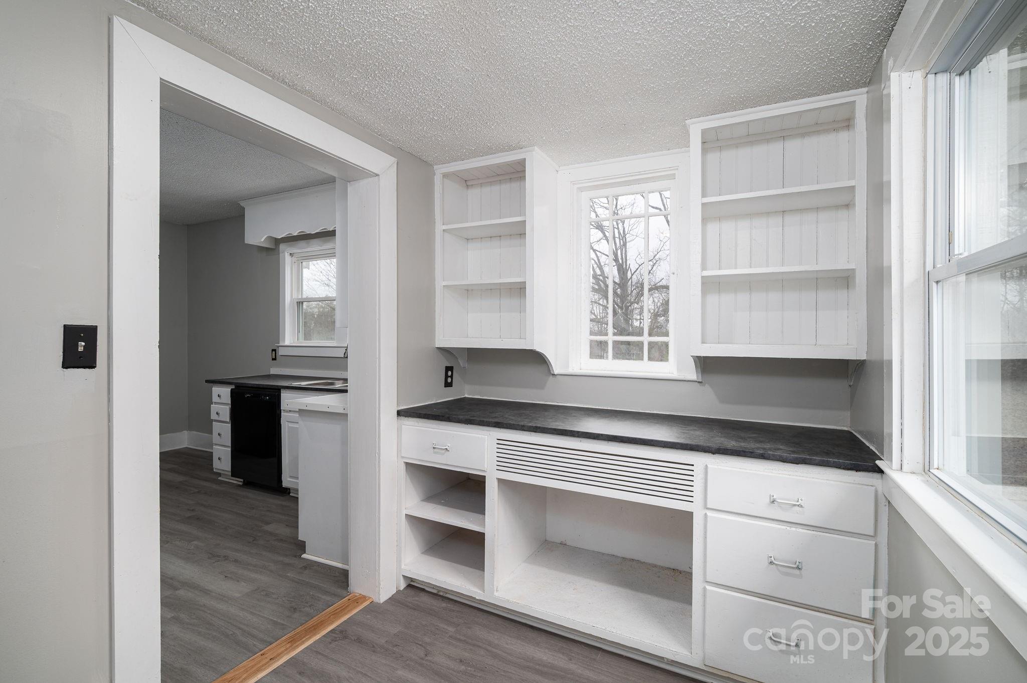 2645 Kool Park Road Northeast Hickory, NC 28601 - Photo 15 of 46 a kitchen with white cabinets and appliances