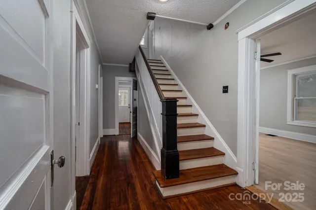 a bathroom with a sink toilet and a mirror