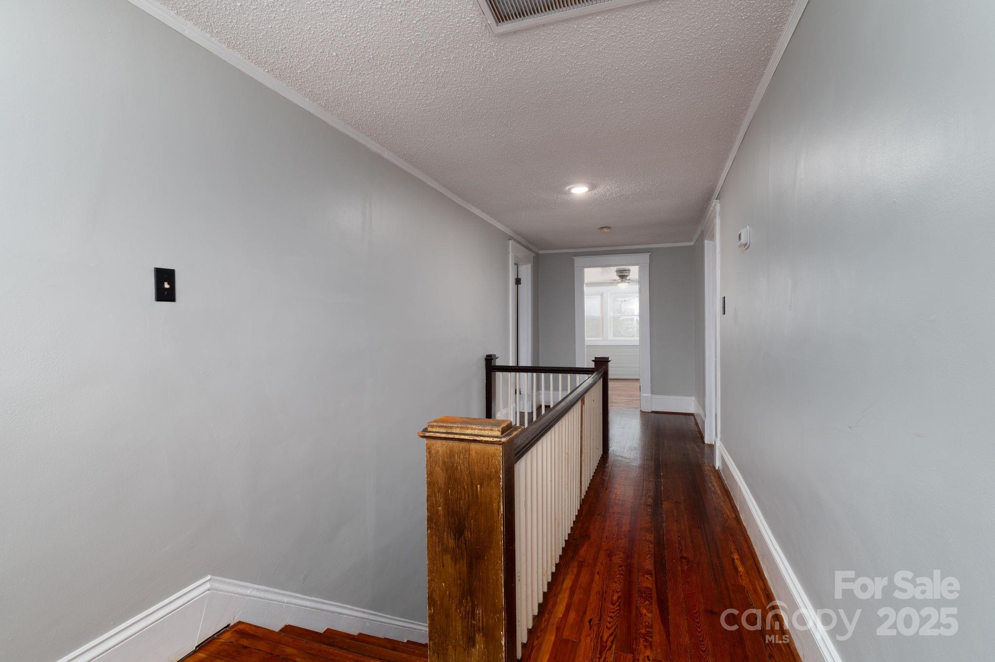 2645 Kool Park Road Northeast Hickory, NC 28601 - Photo 22 of 46 a view of a hallway with wooden floor and staircase