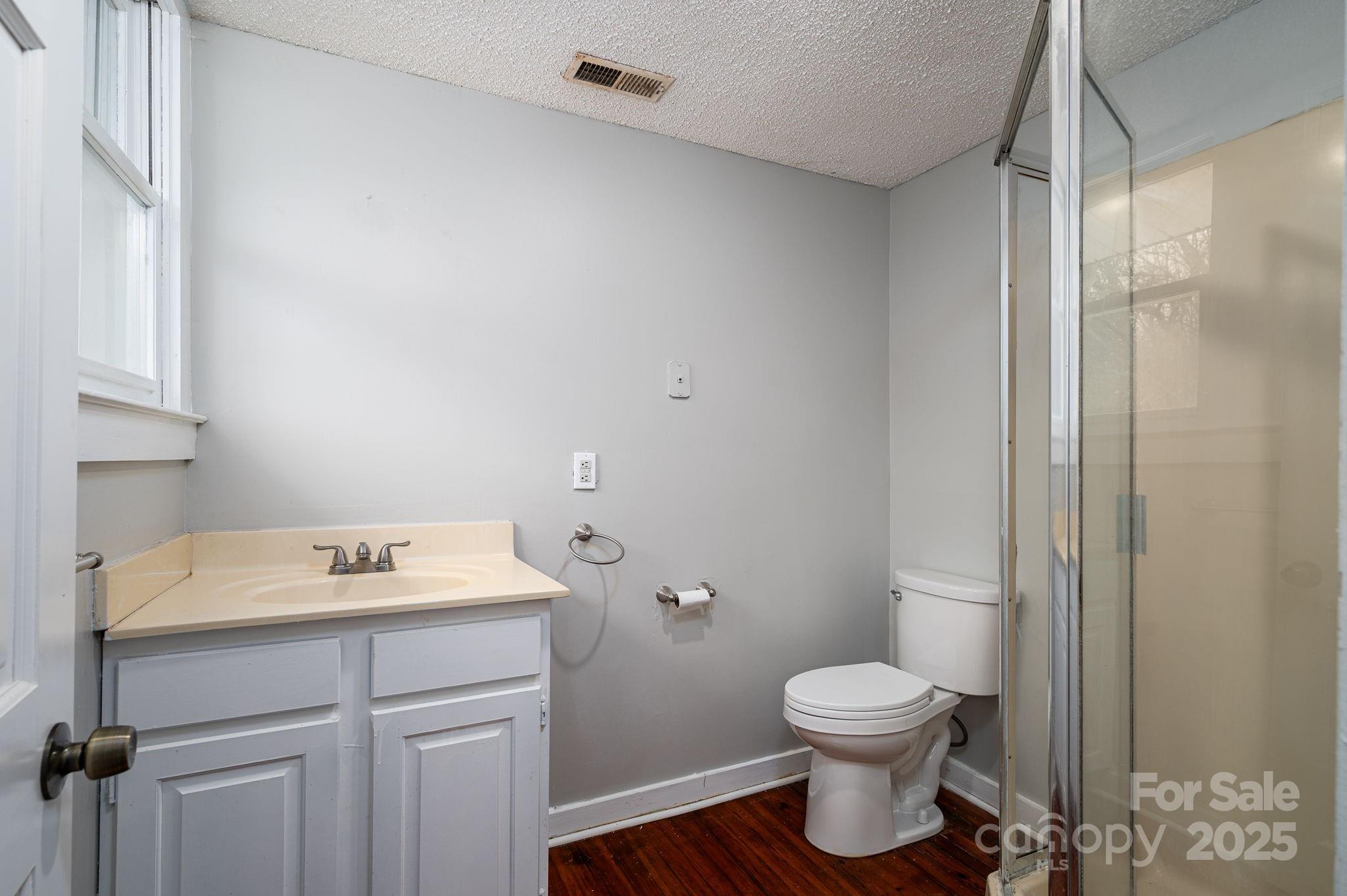 2645 Kool Park Road Northeast Hickory, NC 28601 - Photo 23 of 46 a bathroom with a sink toilet and a mirror