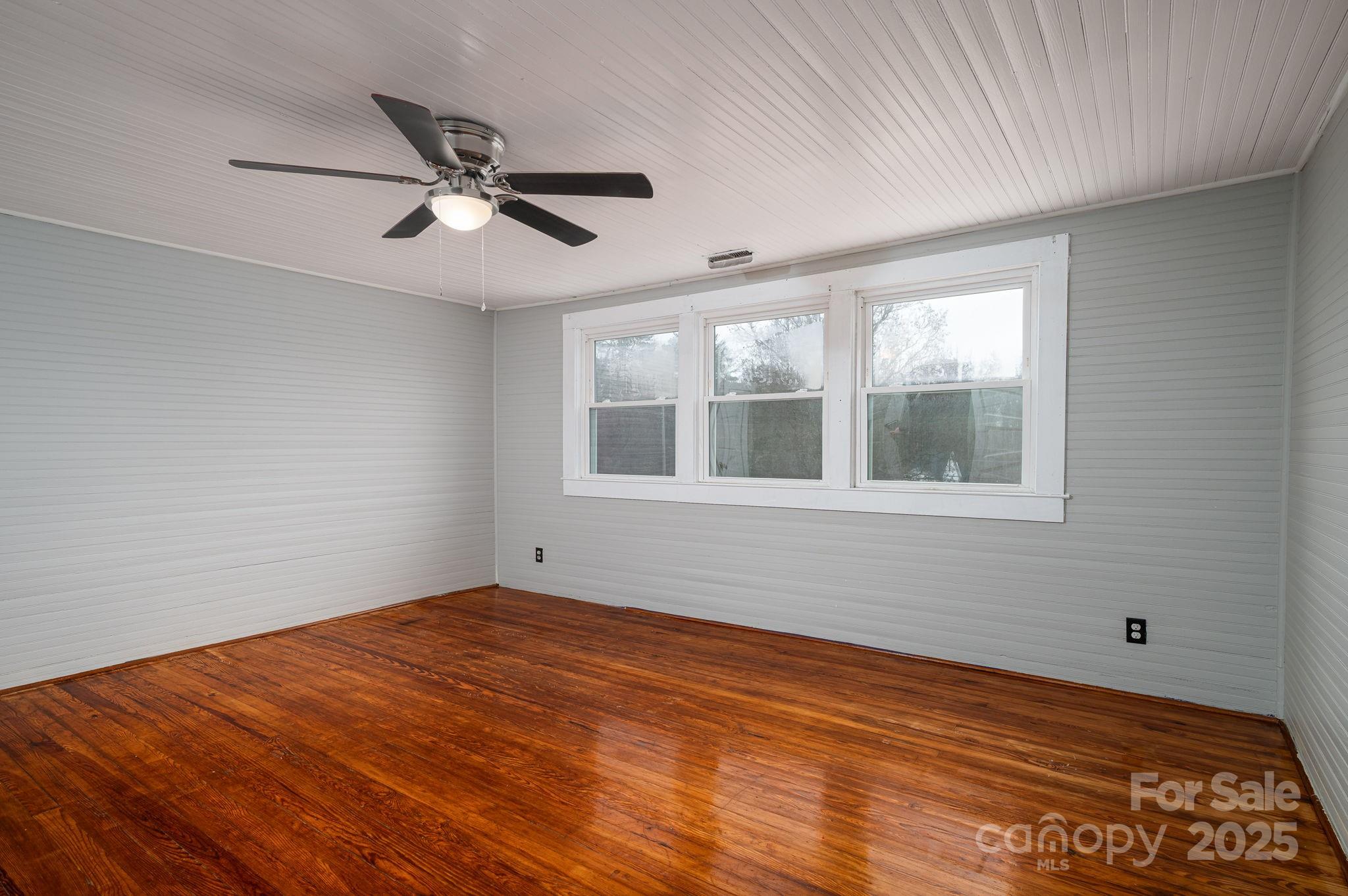 2645 Kool Park Road Northeast Hickory, NC 28601 - Photo 24 of 46 a view of empty room with wooden floor and fan