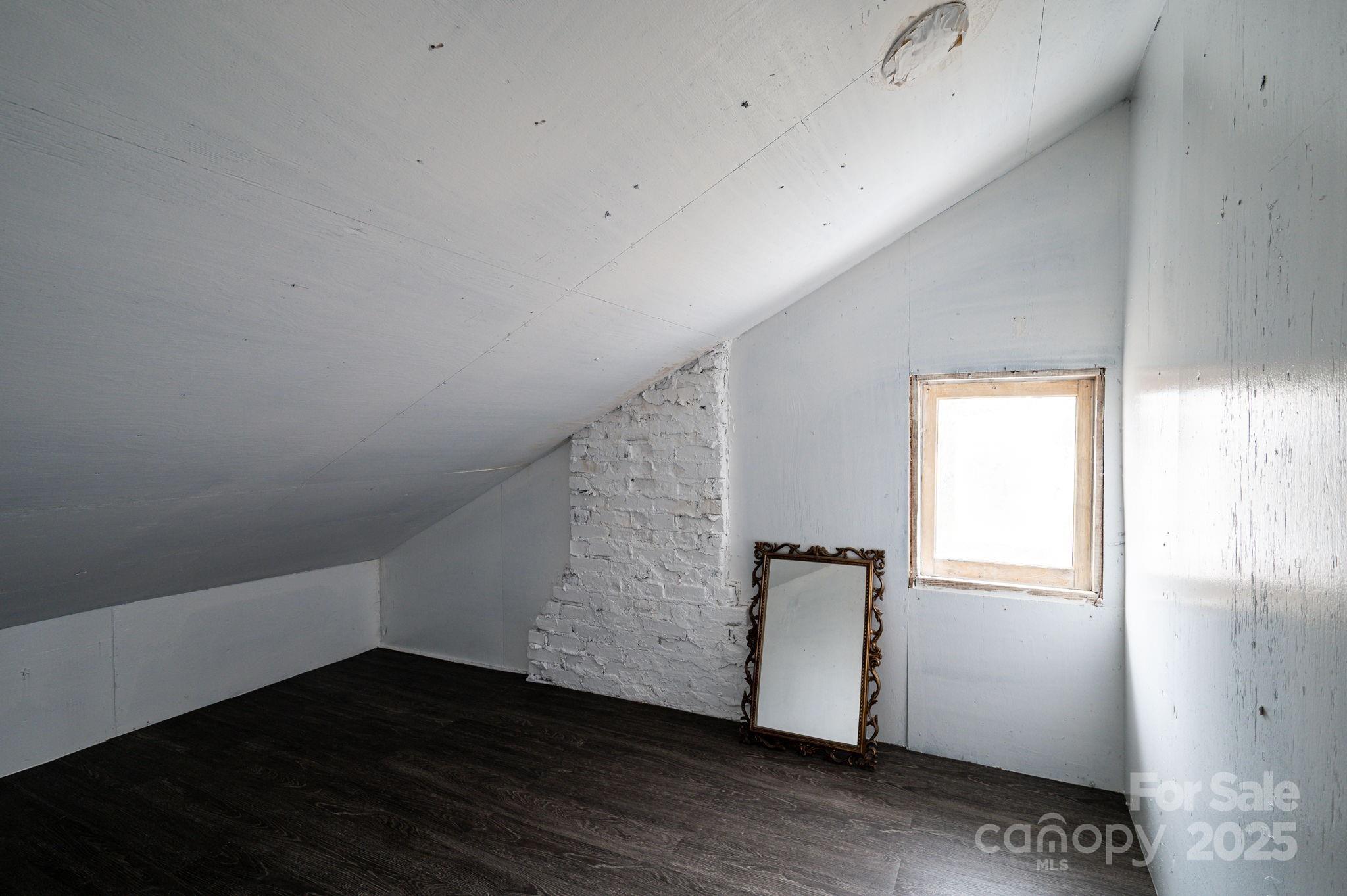 2645 Kool Park Road Northeast Hickory, NC 28601 - Photo 25 of 46 an empty room with wooden floor and windows