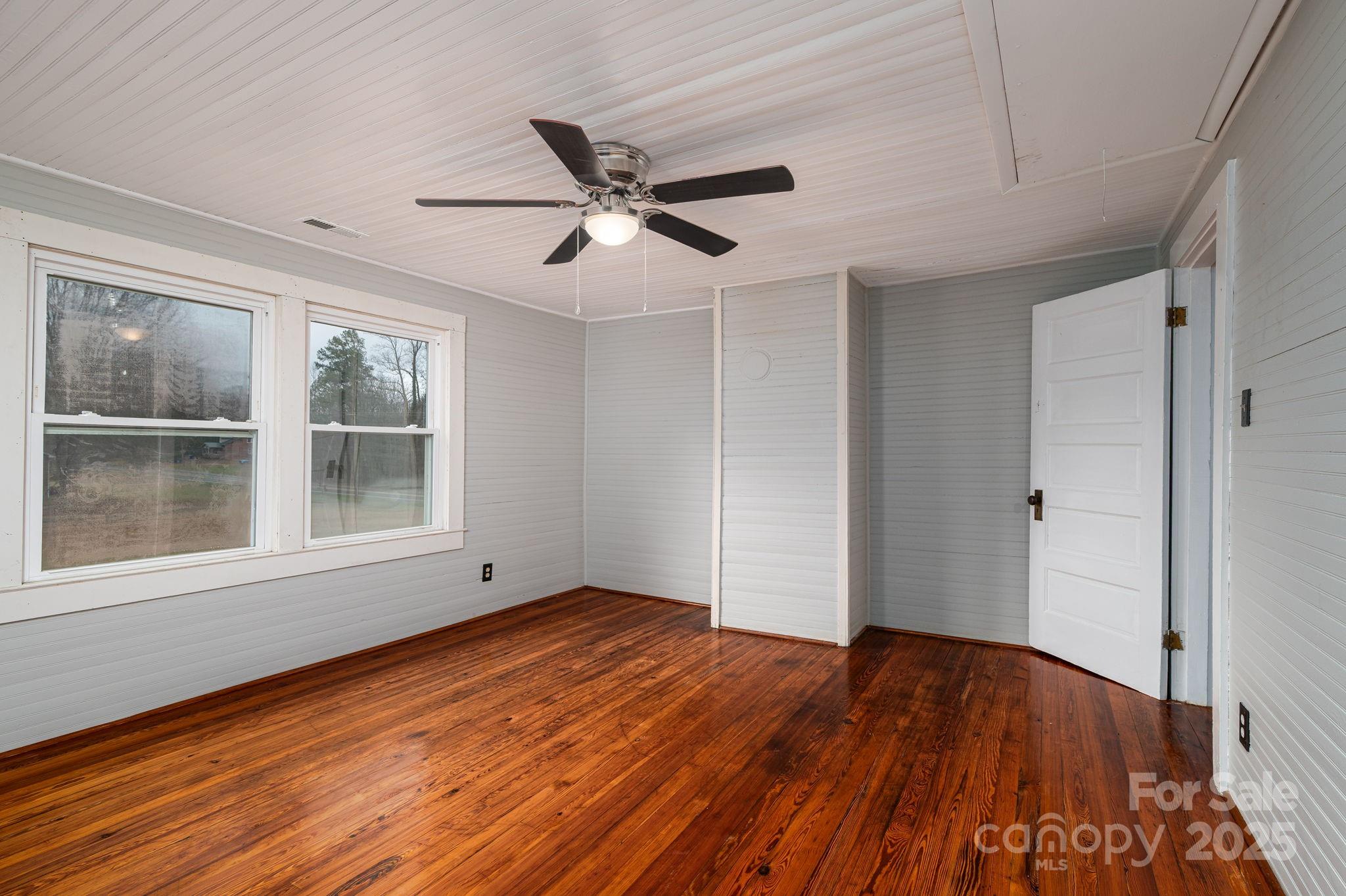 2645 Kool Park Road Northeast Hickory, NC 28601 - Photo 27 of 46 a view of empty room with wooden floor and fan
