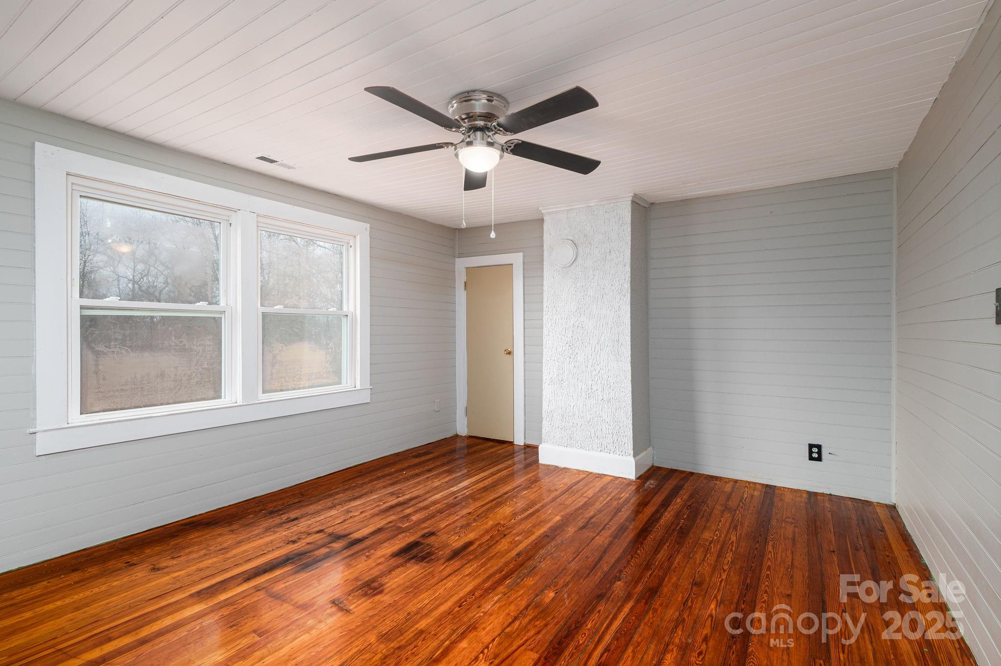 2645 Kool Park Road Northeast Hickory, NC 28601 - Photo 28 of 46 wooden floor in an empty room with a window