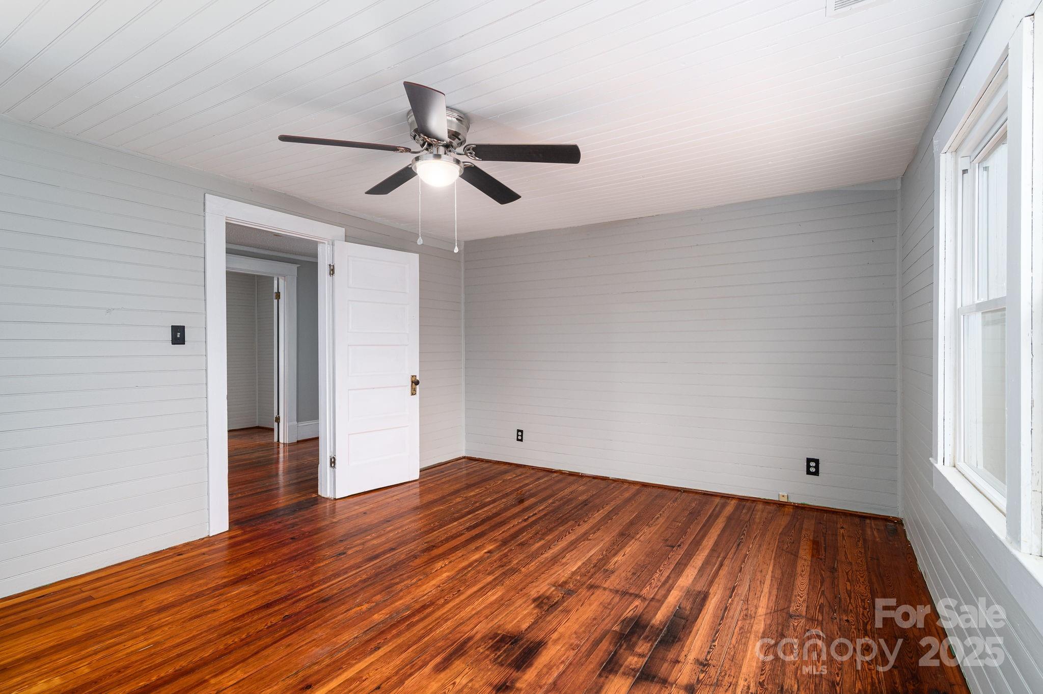 2645 Kool Park Road Northeast Hickory, NC 28601 - Photo 29 of 46 a view of empty room with wooden floor and fan