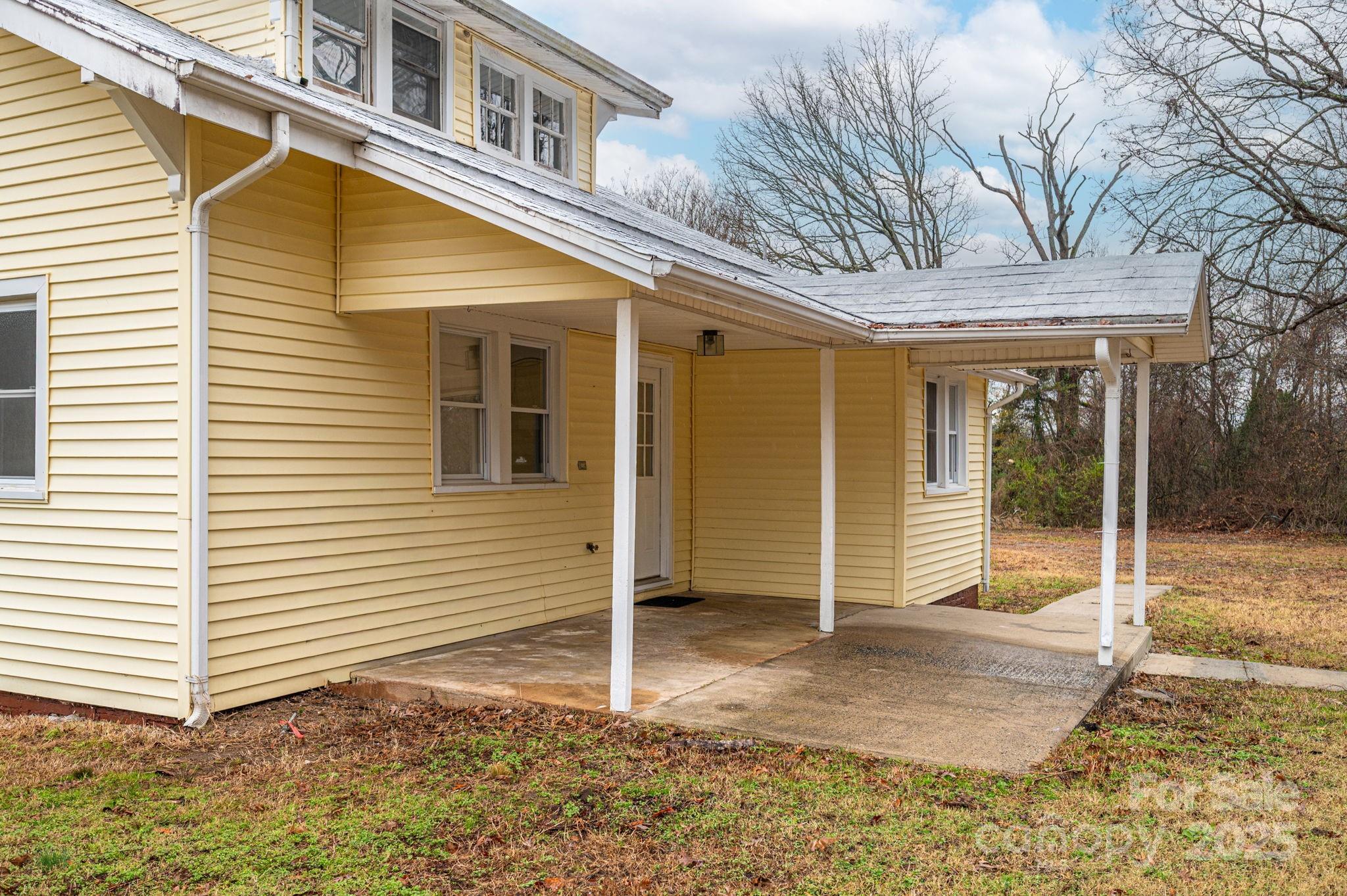 2645 Kool Park Road Northeast Hickory, NC 28601 - Photo 33 of 46 a view of a house with a large window and wooden fence