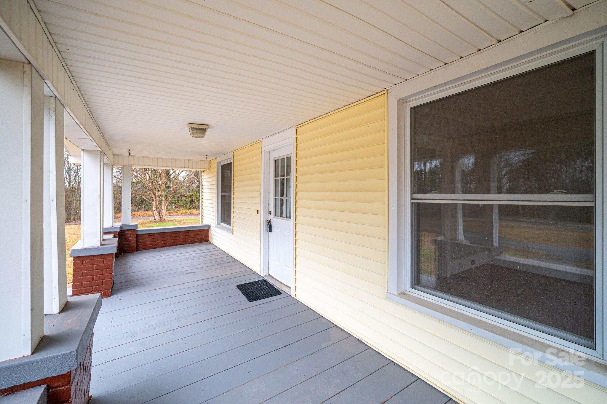2645 Kool Park Road Northeast Hickory, NC 28601 - Photo 5 of 46 a view of a hallway with wooden floor and windows