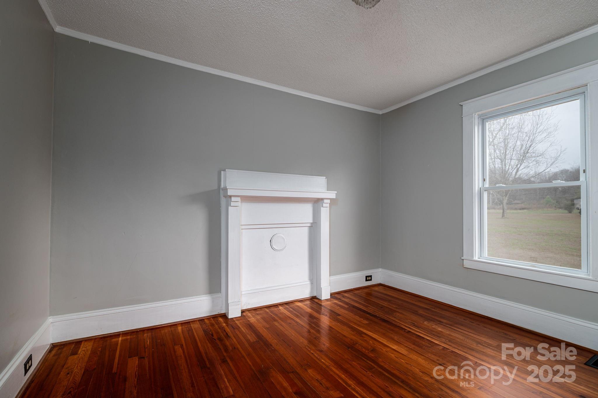 2645 Kool Park Road Northeast Hickory, NC 28601 - Photo 8 of 46 a view of empty room with window and wooden floor