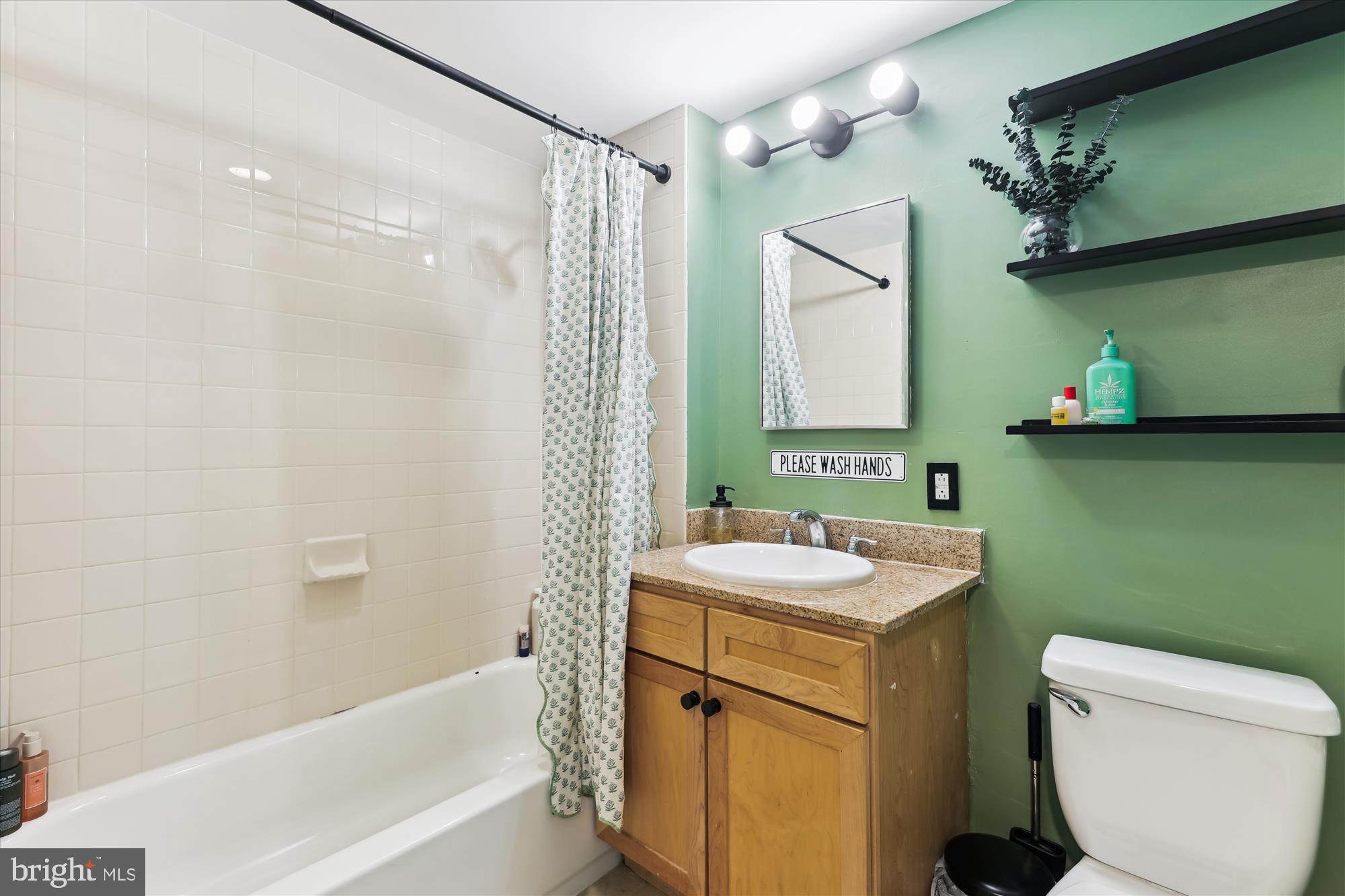 1150 K Street Northwest, Unit 706 Washington, DC 20005 - Photo 19 of 34 a bathroom with a sink toilet and shower