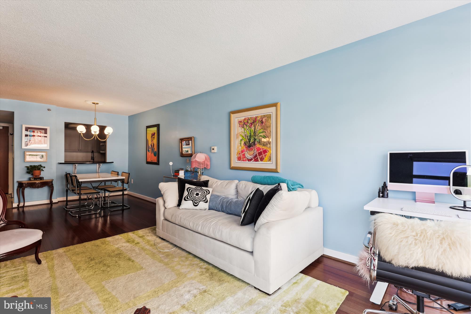 1150 K Street Northwest, Unit 706 Washington, DC 20005 - Photo 5 of 34 a living room with furniture and a flat screen tv