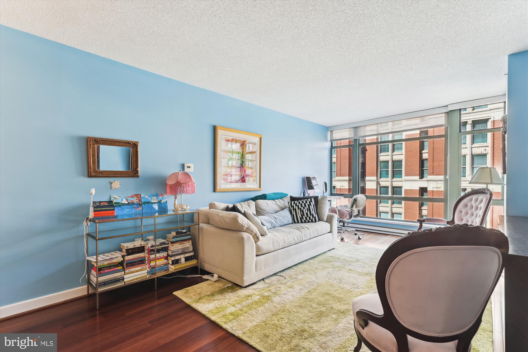 1150 K Street Northwest, Unit 706 Washington, DC 20005 - Photo 6 of 34 a living room with furniture and a flat screen tv